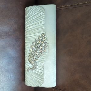 Peacock clutch